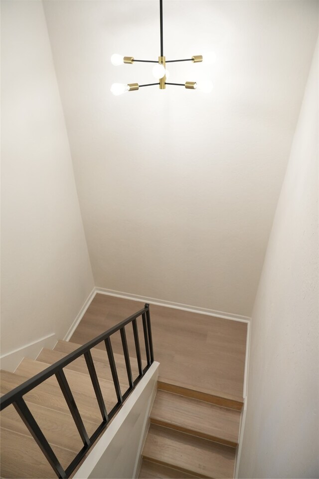 staircase featuring hardwood / wood-style flooring