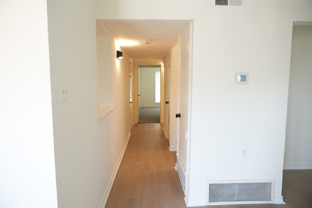 hall featuring wood-type flooring