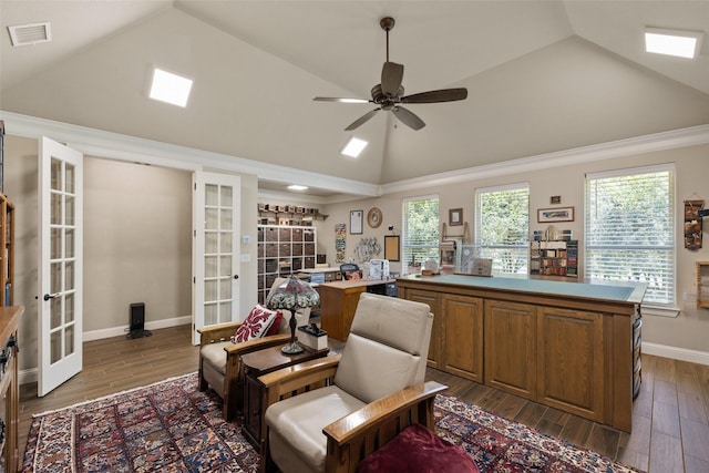 living area with lofted ceiling, wood finished floors, visible vents, baseboards, and french doors