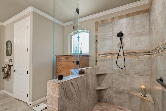 bathroom featuring baseboards, ornamental molding, and walk in shower