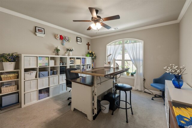 office space featuring carpet, visible vents, crown molding, and ceiling fan