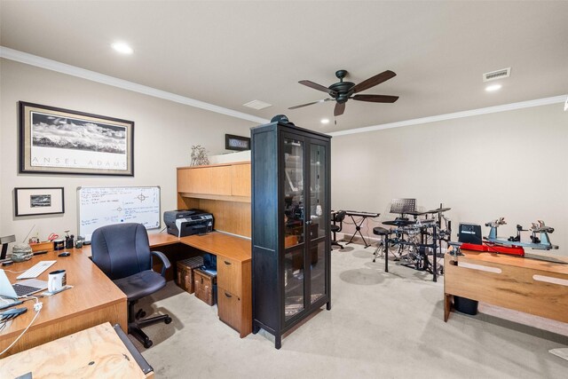 carpeted bedroom with ceiling fan and ornamental molding