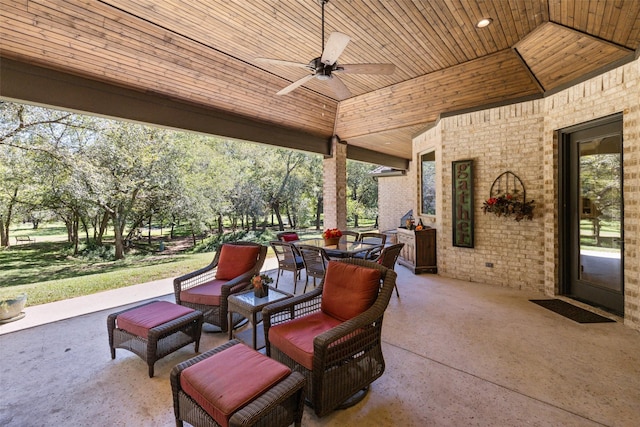 view of patio / terrace with a ceiling fan, outdoor dining area, and an outdoor living space