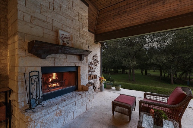 view of patio / terrace featuring an outdoor stone fireplace