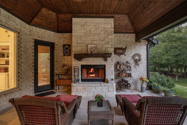 view of patio featuring an outdoor living space with a fireplace