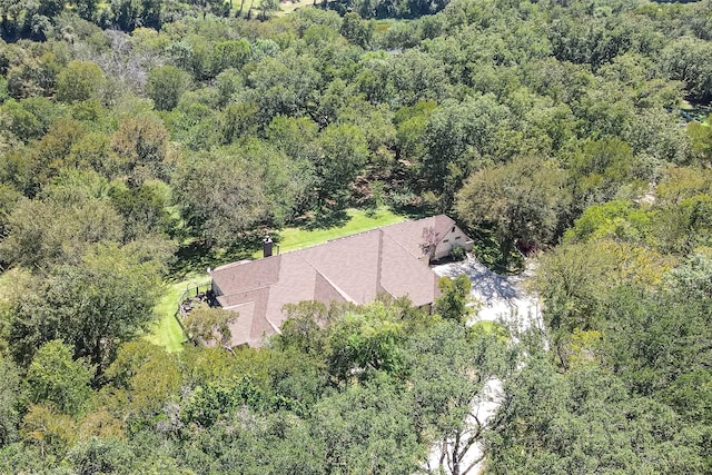 birds eye view of property with a forest view