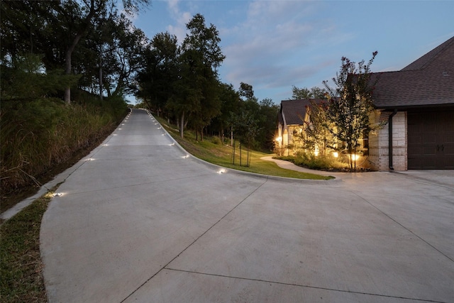 view of street featuring curbs