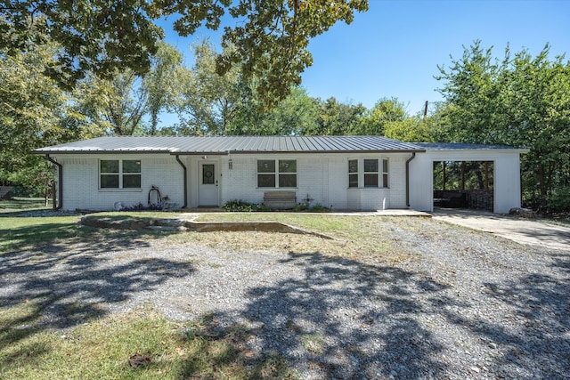 single story home with a carport