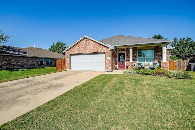 single story home featuring a front lawn and a garage