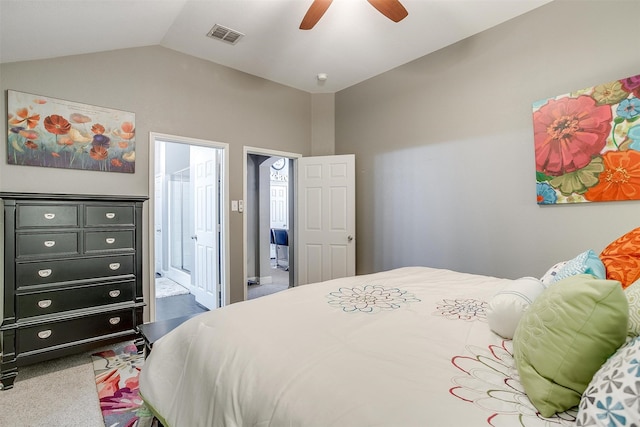 carpeted bedroom with lofted ceiling, connected bathroom, and ceiling fan