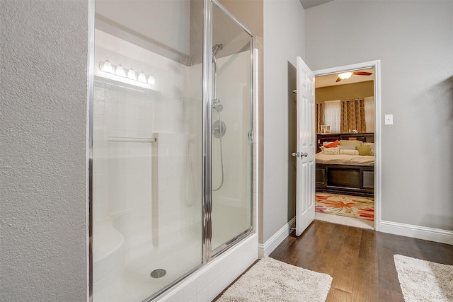 bathroom with wood-type flooring and walk in shower