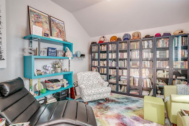 living area featuring vaulted ceiling