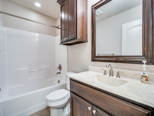 full bathroom featuring toilet, shower / bathing tub combination, and vanity