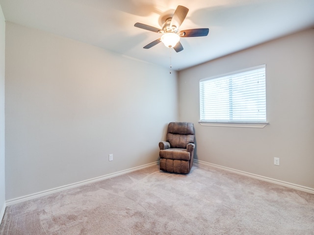 unfurnished room with ceiling fan and light colored carpet