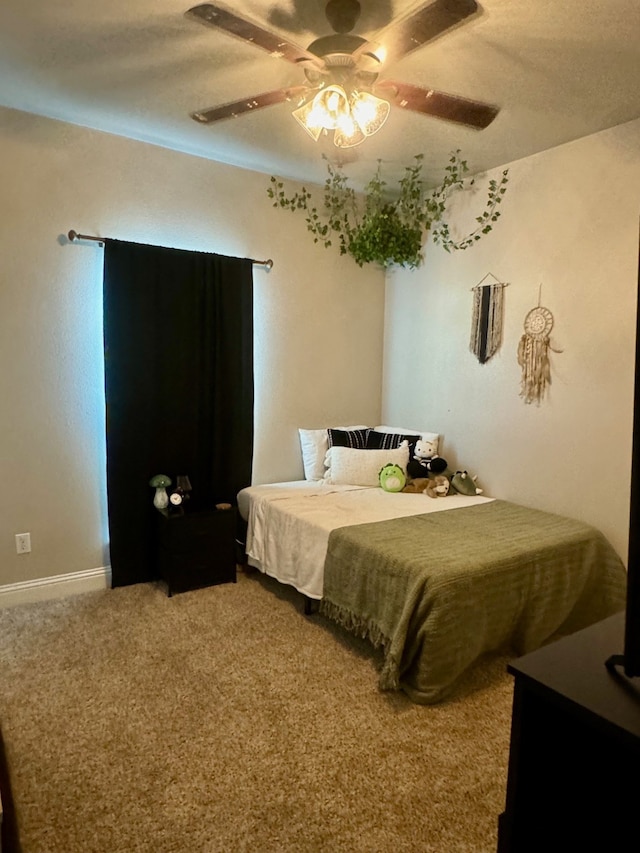 bedroom with ceiling fan and carpet flooring