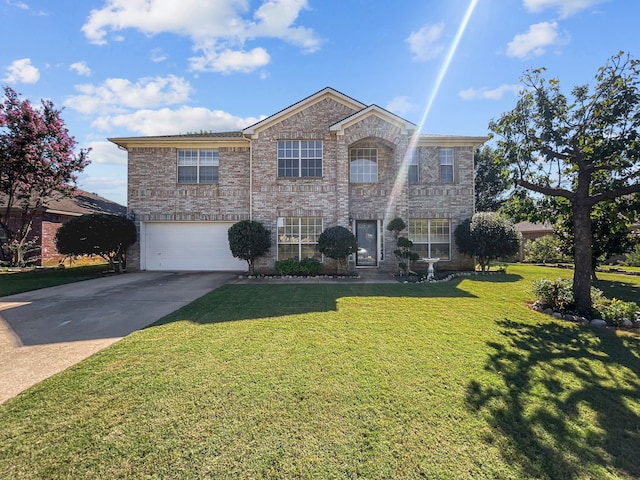 view of front property with a front lawn and a garage