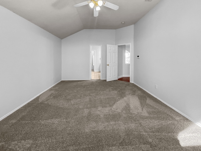 interior space featuring ceiling fan and vaulted ceiling