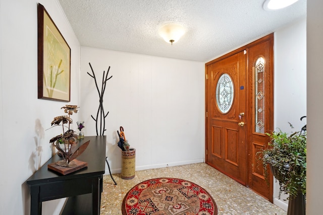 entrance foyer with a textured ceiling