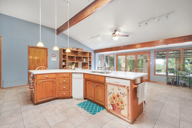 kitchen with white dishwasher, vaulted ceiling with beams, hanging light fixtures, a textured ceiling, and sink