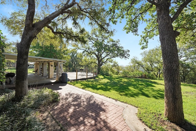 view of community with a yard and a deck