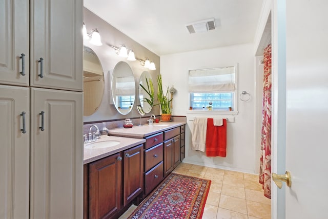 bathroom featuring tile patterned floors and vanity