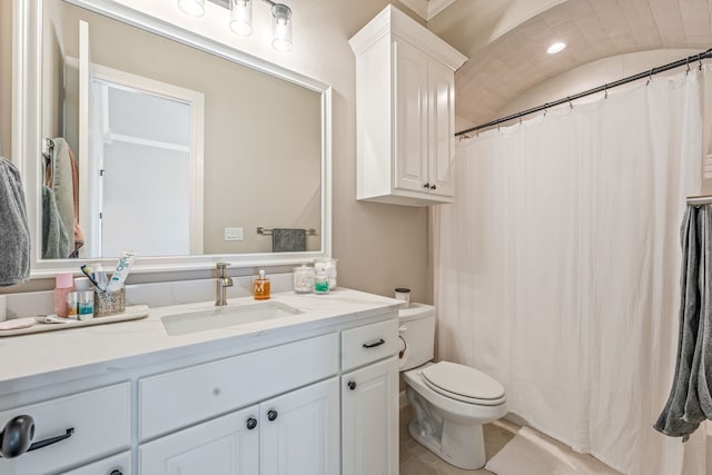 bathroom with tile patterned flooring, toilet, lofted ceiling, a shower with curtain, and vanity