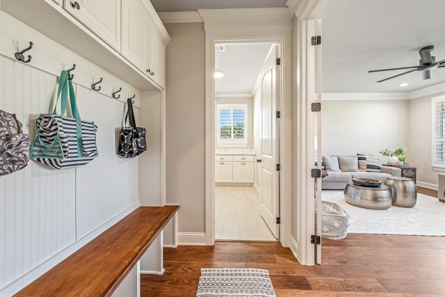 mudroom featuring ceiling fan, dark hardwood / wood-style floors, and ornamental molding