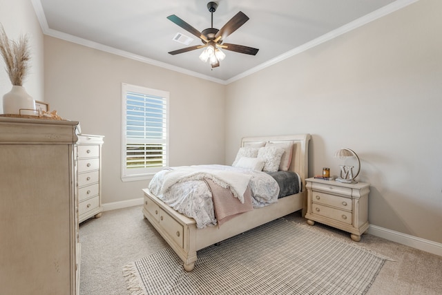 bedroom featuring crown molding, ceiling fan, and light carpet