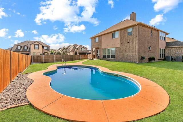 view of swimming pool featuring central air condition unit and a lawn