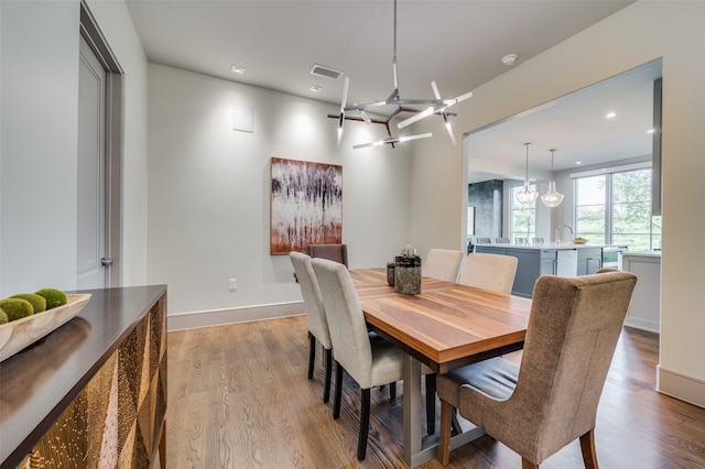 dining area with light hardwood / wood-style flooring