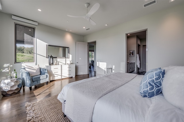 bedroom with ceiling fan and hardwood / wood-style flooring