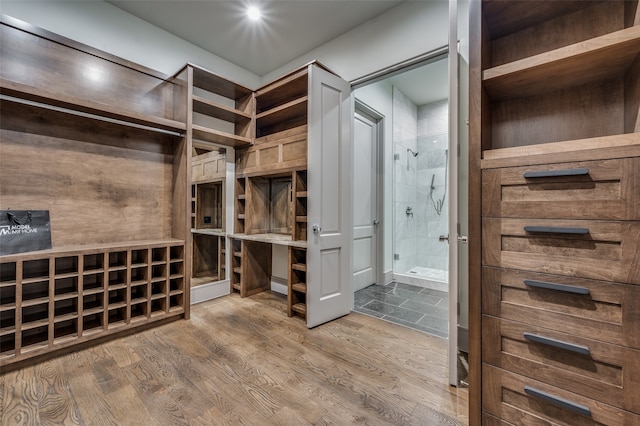 spacious closet featuring hardwood / wood-style flooring