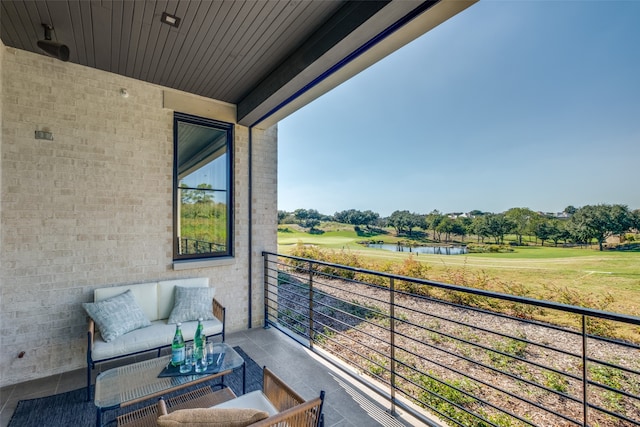 balcony featuring a water view