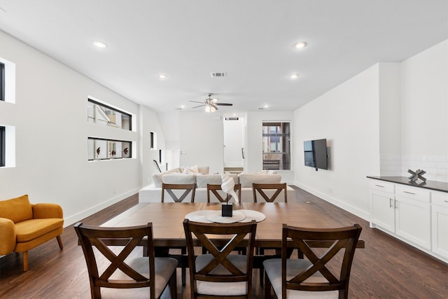 dining room featuring dark wood-type flooring and ceiling fan