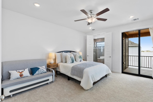 carpeted bedroom featuring multiple windows, ceiling fan, access to exterior, and ensuite bathroom