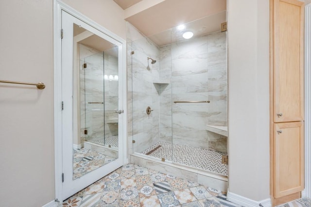 bathroom featuring a shower with door