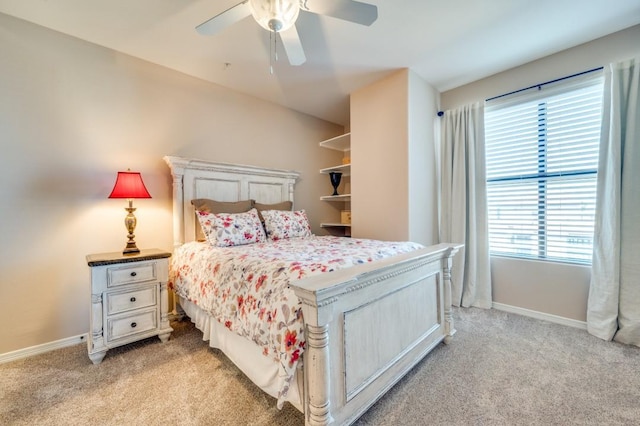 bedroom featuring ceiling fan and light carpet