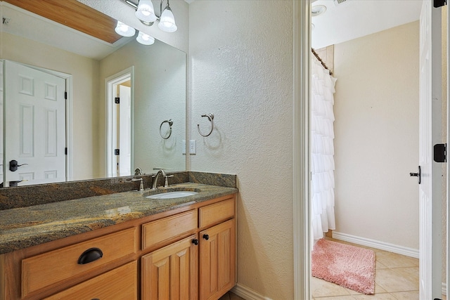 bathroom featuring vanity and tile patterned flooring