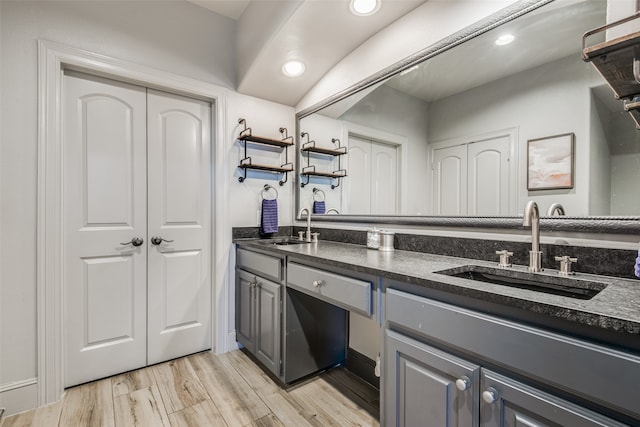 bathroom with vanity and hardwood / wood-style floors