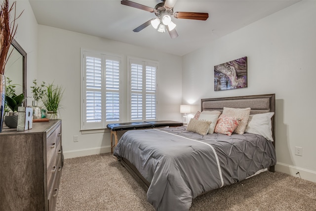 bedroom featuring ceiling fan and light carpet