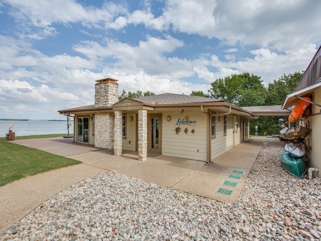 view of front of house featuring a water view