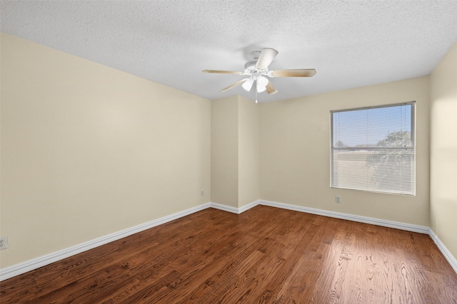 spare room featuring wood-type flooring, ceiling fan, and a textured ceiling