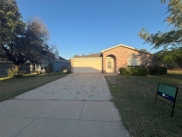 single story home featuring a front yard and a garage