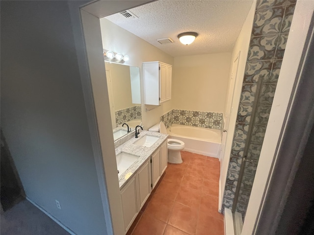 bathroom with vanity, tile patterned flooring, a textured ceiling, and separate shower and tub