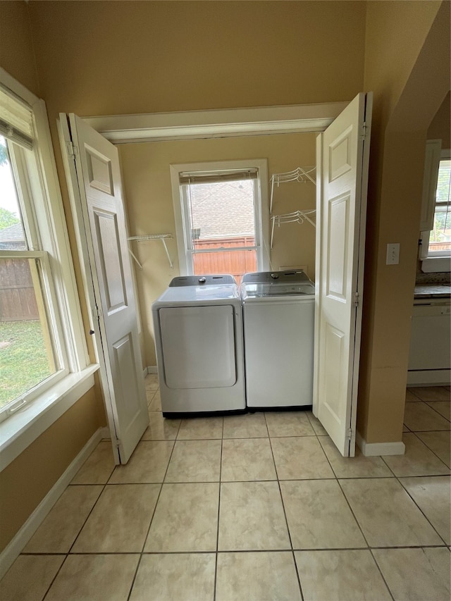 washroom with a wealth of natural light and independent washer and dryer