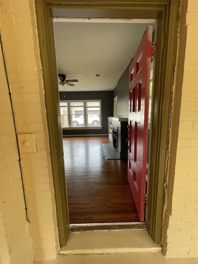 corridor featuring dark hardwood / wood-style flooring