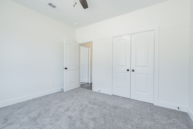 unfurnished bedroom featuring carpet flooring, a closet, and ceiling fan