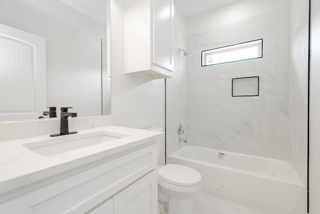 full bathroom featuring tiled shower / bath, toilet, and vanity