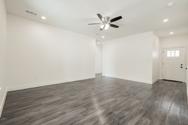 interior space featuring dark wood-type flooring and ceiling fan