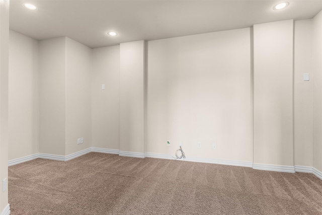 spare room with recessed lighting and carpet